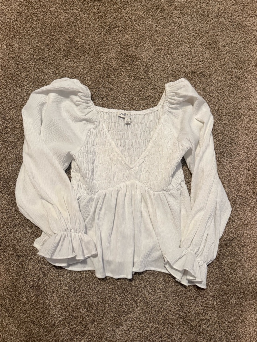 Smocked V-Neck Peplum Blouse in White